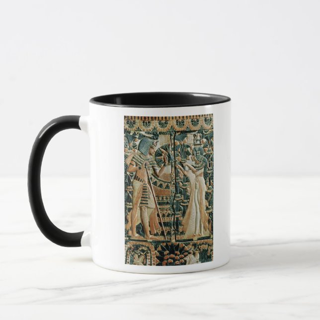Plaque from the lid of coffer showing mug (Left)