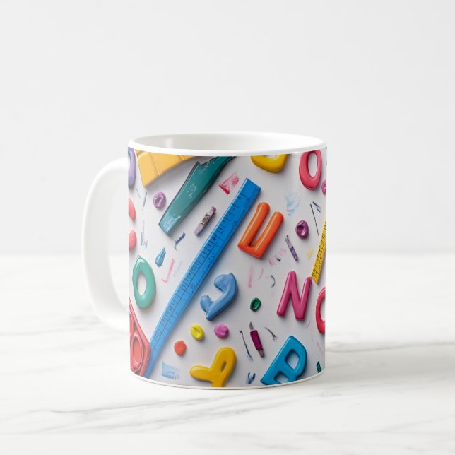 Plastic letters arranged artistically on a dark bl coffee mug (Front Left)