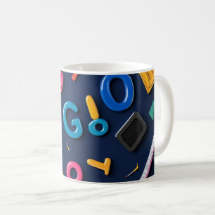 Plastic letters arranged artistically on a dark bl coffee mug