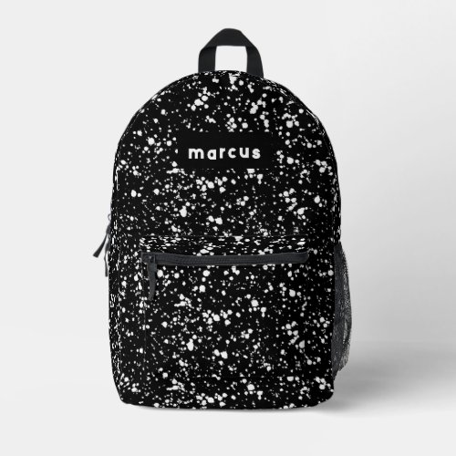 Playful artistic white splatter on black with name printed backpack