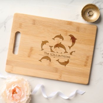 Playful Dolphins Family Name Cutting Board by millhill at Zazzle