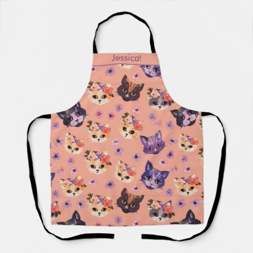 Playful Floral Crown Cat Faces on Peach Background Apron