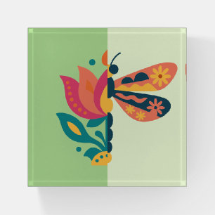 Playful insect and flower graphic design paperweight