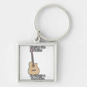 Playing the guitar is always a good idea. vintage keychain
