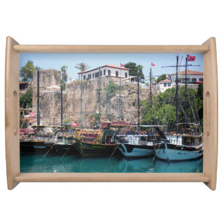 Pleasure yachts near the walls serving tray
