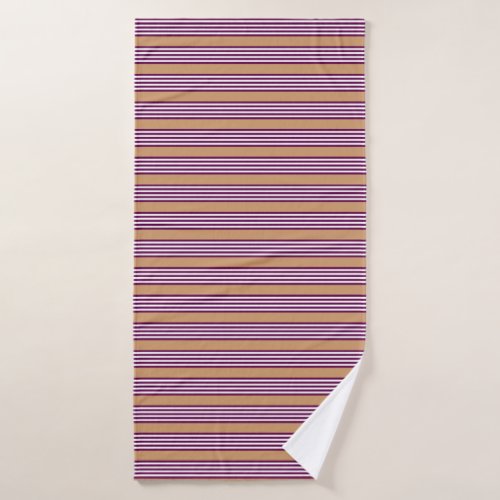 Plum and white five stripes pattern with tan bath towel