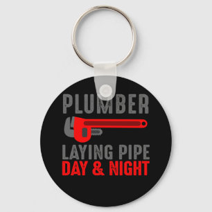 Plumber laying pipe day and night keychain
