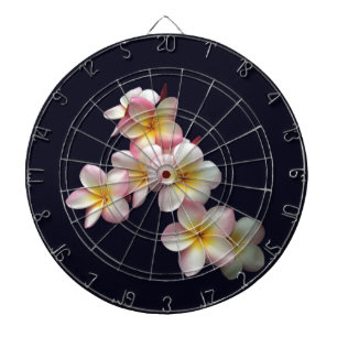 Plumeria blossoms on dark blue dart board