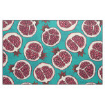 Pomegranate slices on turquoise fabric