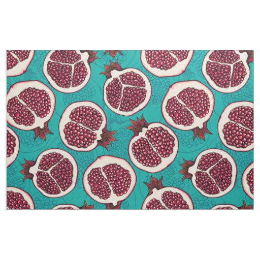 Pomegranate slices on turquoise fabric