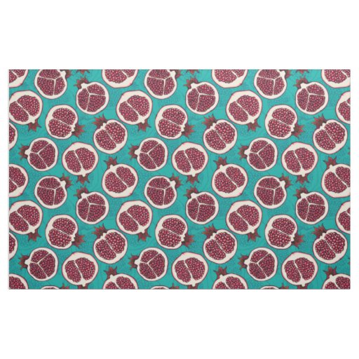 Pomegranate slices on turquoise fabric