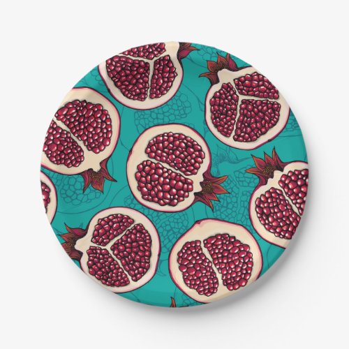 Pomegranate slices on turquoise paper plates