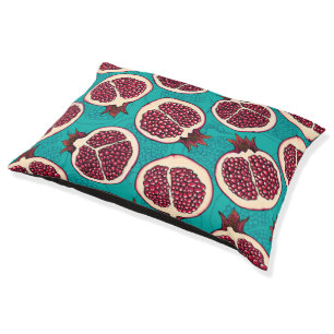 Pomegranate slices on turquoise pet bed