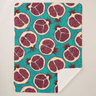 Pomegranate slices on turquoise sherpa blanket