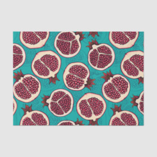 Pomegranate slices on turquoise tissue paper