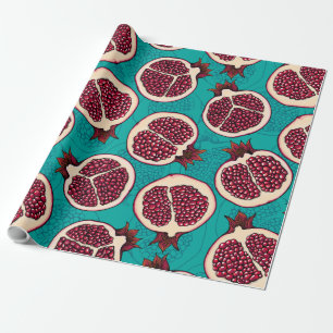 Pomegranate slices on turquoise wrapping paper