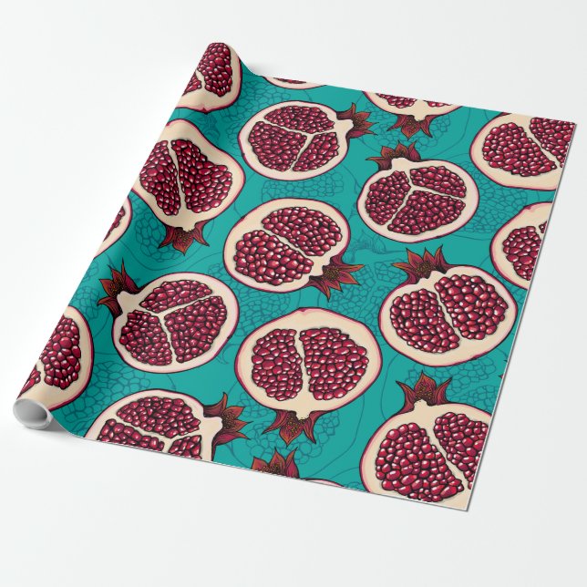 Pomegranate slices on turquoise wrapping paper (Unrolled)
