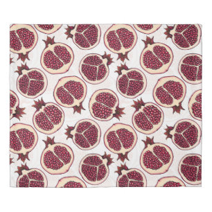 Pomegranate slices on white duvet cover