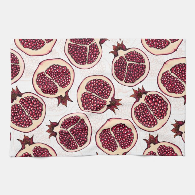 Pomegranate slices on white kitchen towel (Horizontal)