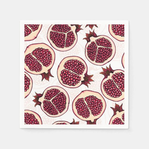 Pomegranate slices on white napkins