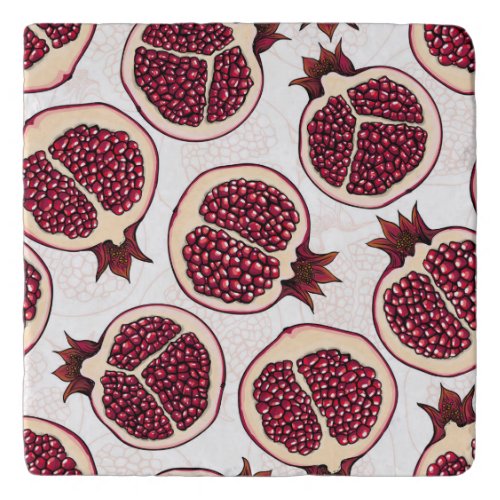 Pomegranate slices on white trivet