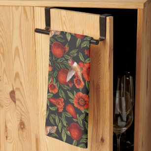 Pomegranates and hummingbirds/green leaves on blac kitchen towel