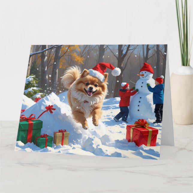 Pomeranian Running in Snow with Christmas Hat Card (Front)