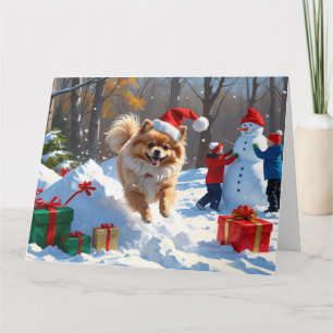 Pomeranian Running in Snow with Christmas Hat Card
