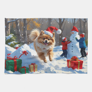 Pomeranian Running in Snow with Christmas Hat Kitchen Towel