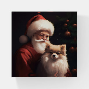 Pomeranian With Santa Claus Festive Christmas Paperweight