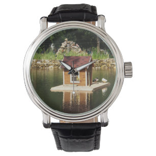 Pond with bird house watch