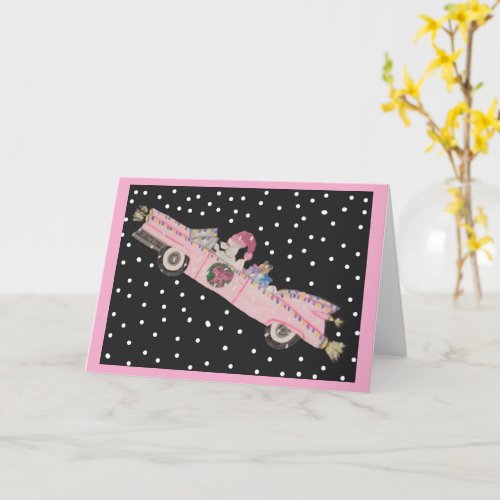 Poodle at Christmas in a pink convertible Card
