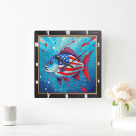 Pop Art Patriotic Fish  Square Wall Clock<br><div class="desc">This vibrant wall clock features a unique pop art style fish, boldly adorned with the American flag's stars and stripes against a dynamic blue background with red splatters. This artistic timepiece is a playful yet patriotic addition to any home decor, offering a colorful and modern statement piece that celebrates both...</div>