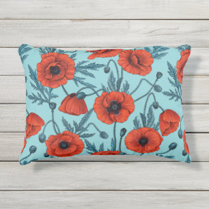 Poppies, red and blue on pool blue outdoor pillow