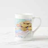 porcelain cup with euro currency (Right)