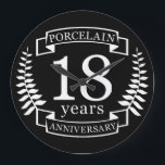Porcelain traditional wedding anniversary 18 years large clock<br><div class="desc">A design to celebrate 18 years of marriage. This design has a white (Porcelain) colored laurel design on a black background. Porcelain is the traditional gift for this occasion. The text reads Porcelain 18 years anniversary. A romantic design to celebrate your 18th year of marriage. If you would like any...</div>