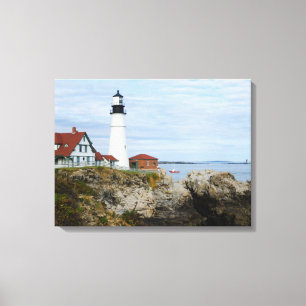 Portland Headlight lighthouse on rocky shore Canvas Print