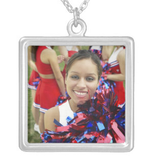 Portrait of a Cheerleader in Front of a Group of Silver Plated Necklace