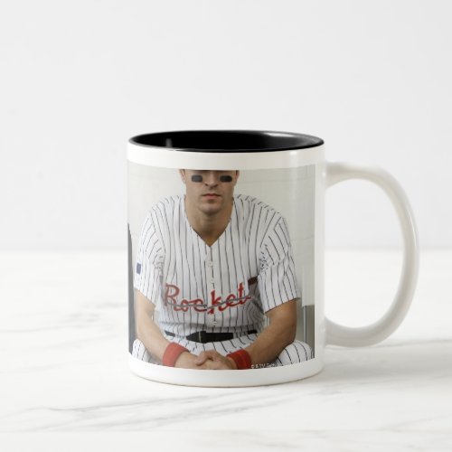 Portrait of baseball player sitting in locker Two_Tone coffee mug