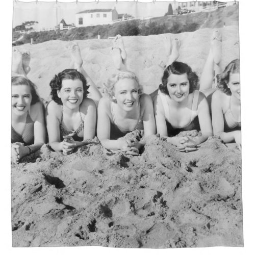 Portrait of five young women lying on the beach an shower curtain