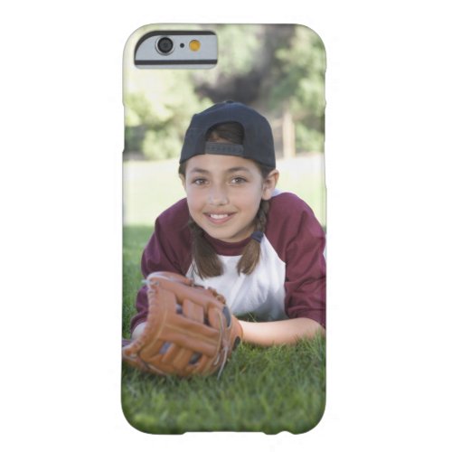 Portrait of girl lying on ground with baseball barely there iPhone 6 case