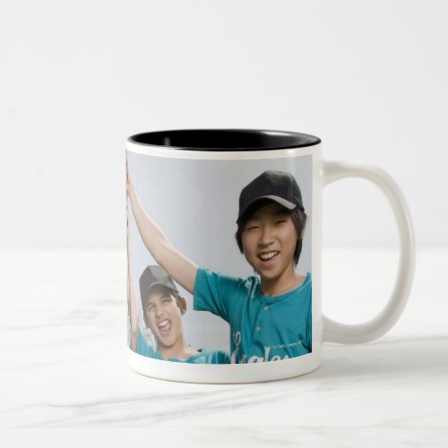 Portrait of little league players with trophy Two_Tone coffee mug