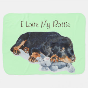 portrait painting of cute rottweiler puppy dog receiving blanket