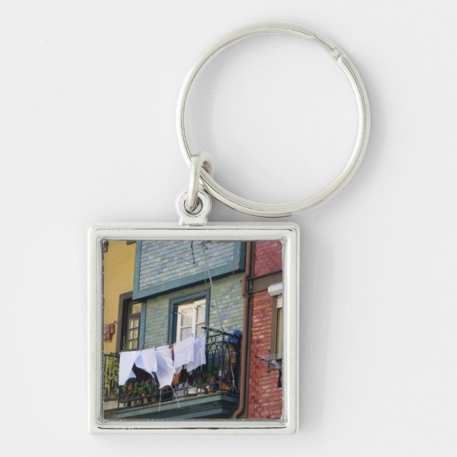 Portugal, Oporto (Porto). Woman hanging laundry Keychain (Front)