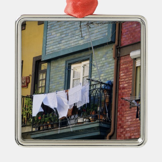 Portugal, Oporto (Porto). Woman hanging laundry Metal Ornament (Front)