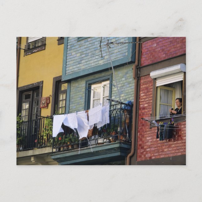 Portugal, Oporto (Porto). Woman hanging laundry Postcard (Front)