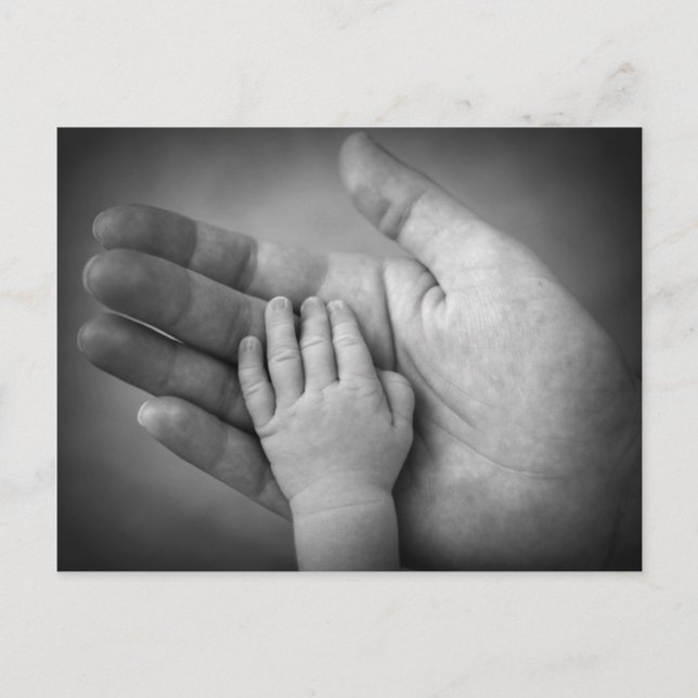 Postcard baby's hand in mothers hand. (Front)