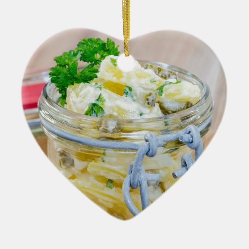Potato salad in a jar on wooden ceramic ornament