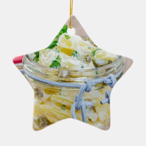 Potato salad in a jar on wooden ceramic ornament