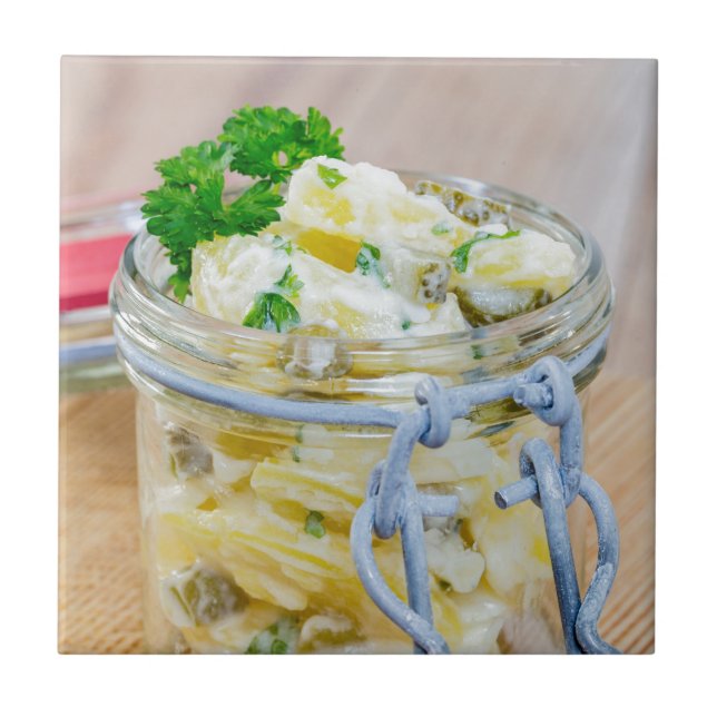 Potato salad in a jar on wooden ceramic tile (Front)